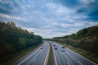 multi-lane highway has lanes with varying speeds and gas consumption rates