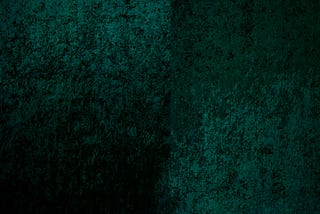 a close up of a green velvet fabric