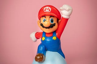 A man-toy caricature showing indicating he has a superpower.