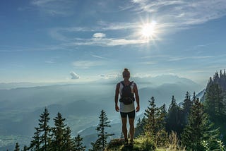 Female hiker standing on a mountain