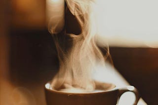 steam rising up from a cup of coffee