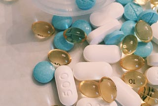 assortment of differently colored pills