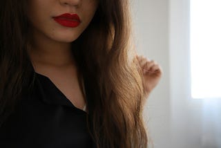 A woman’s closed mouth.