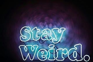 Neon sign reading ‘Stay Weird’