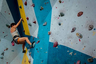 a woman bouldering