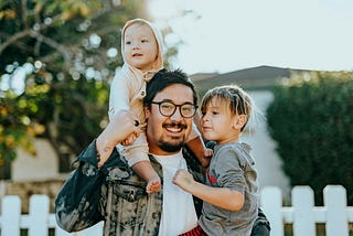 A father spending precious time with his children, engaging in a warm and supportive interaction that highlights the importance of the father’s role in parenting and emotional development by Moustafid