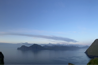the sea at three in the morning on the summer solstice, with a blue sky