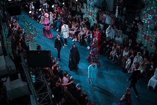 Bird eye view of models walking in a runway show