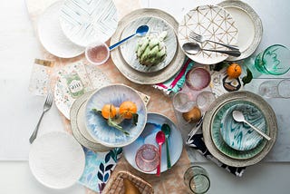 Several dishes on a table containing exotic foods