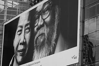 Two faces on a billboard