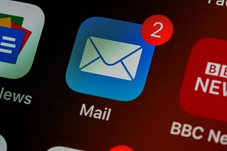 A mobile phone screen showing two emails are within the mailbox