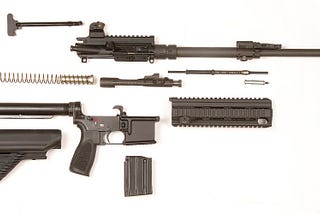 A disassembled AR15-style rifle showing the modularity and configurability of the rifle, a large part of its popularity and generic function.