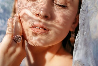 A woman with closed eyes