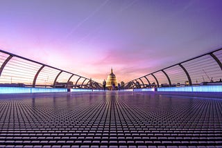 Millenium Bridge in London, facing St. Paul’s Cathedral at sundown.