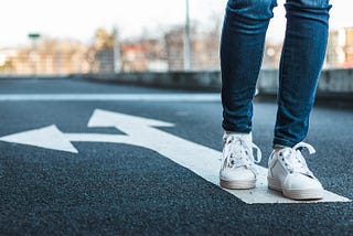 image of person walking against the arrow directions