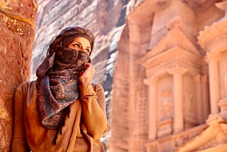 A woman admiring the most famous monument of the ancient city of Petra.