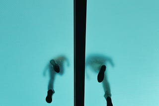 silhouettes walking on the glass ceiling