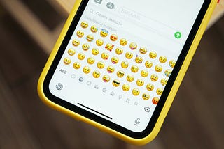 The emoji selection panel on a smartphone, displaying a variety of faces