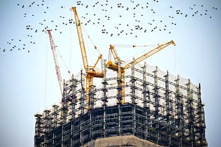 A Building Being Built Full Of Scaffolding Here And There!