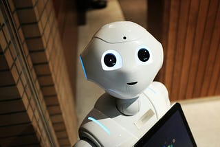 photo of a robot with eyes looking up at the camera