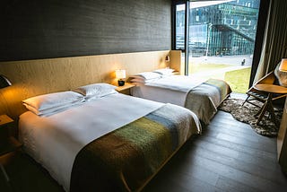 An hotel room with two double beds