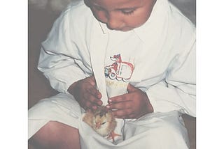 Picture of myself as a kid holding a chick at kindergarden.