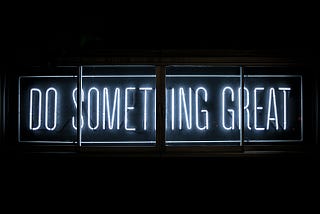 Black background with white text reading “Do Something Great”