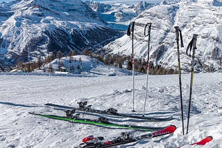 Skis and poles atop the mountain.