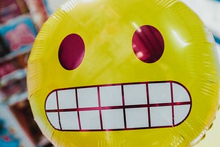 A yellow balloon cringing in dispair