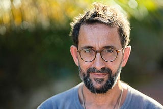 An anxious man pretends he’s okay by putting on a brave face
