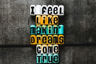 A sign saying “I feel like makin’ dreams come true.”