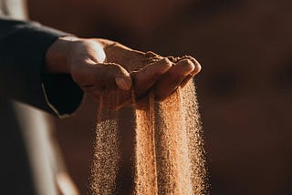 Here is an image of sand slipping through a man’s finger, representing time slipping by and our need to recognize the precious time given to each of us and use it wisely.