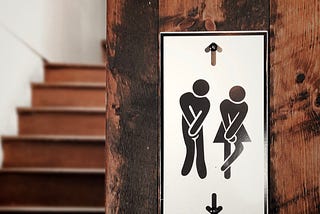 Male and female illustrations, indicating they need to use the bathroom