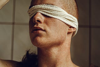 Trichotillomania or hair-pulling representation, man shaving his hair