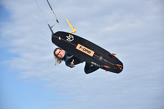 Kiteboarder Matt Maxwell performing tricks in the ocean