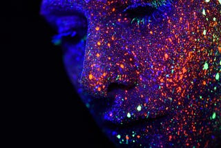 Sparkles of color on a face. Color affects your world and your life.