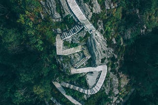 Steep winding staircase down a mountain.