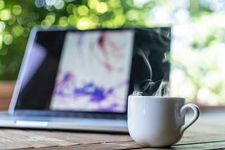 cup of coffe and laptop computer