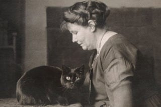 The novelist and philosopher May Sinclair, with a black cat