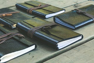 Variety of black leather-bound journals