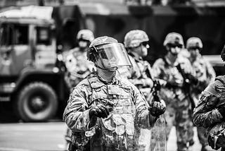 People in riot gear are seen