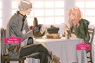A picture of Harij and Rose eating together at a table next to windows that let sunshine in
