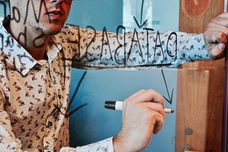 Person drawing a mind map which says databases in the middle.