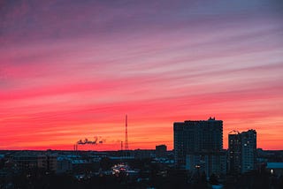 Sunset over a city and its buildings