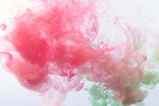 Puffs of pink and green smoke
