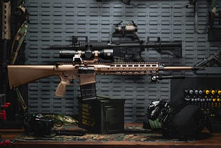 A picture of a gun with a scope