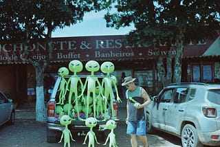 Blow up alien dolls on back of truck