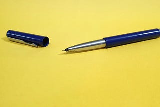 Pen and cap on a surface