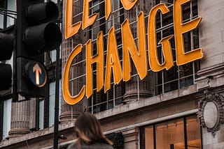 “Let’s Change” sign on a building