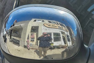 My Bookshop as Reflected on the Back of a Sideview Mirror